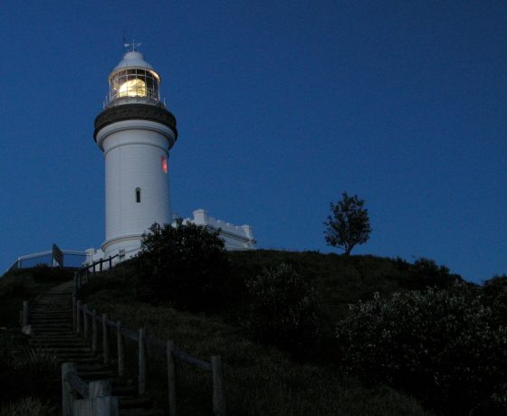 The lighthouse situated high on Cape Byron, Australia's most easterly landfall where we rise before dawn to walk the beach in moonlight arriving on the Cape for sunrise over the Pacific Ocean