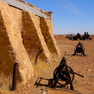 Side of old sheep shearing shed and machinery relics, seen on our Corner Country Outback Tour