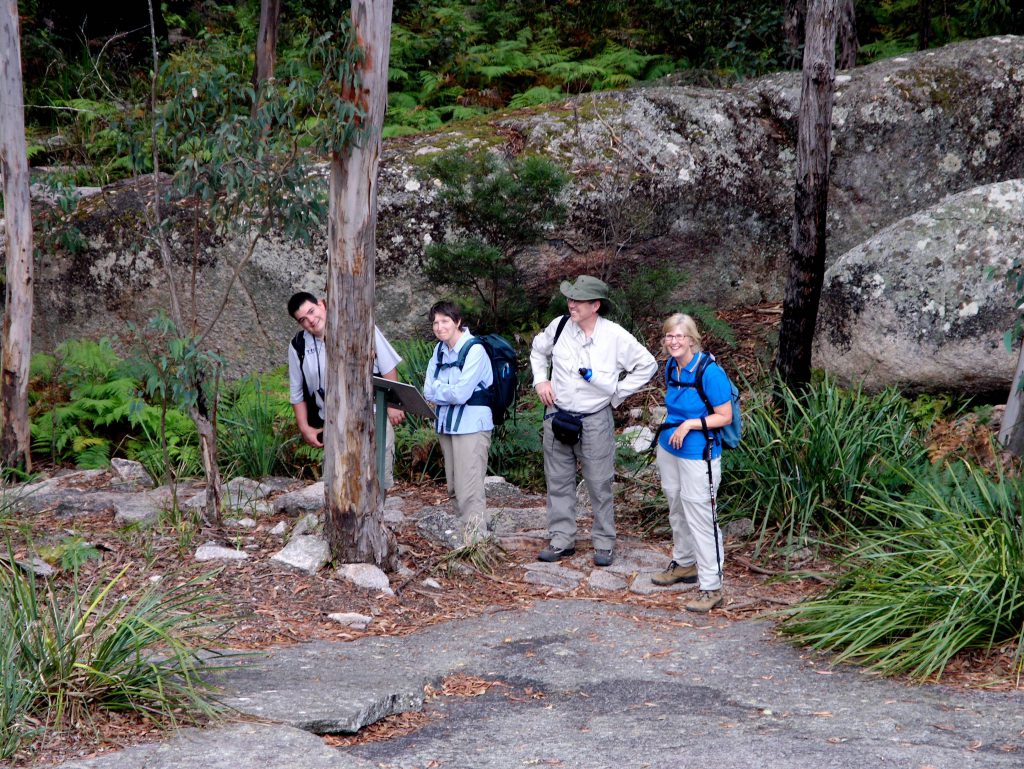 Smiles all around when connecting to nature at Bald Rock National Park on our Great Divide Iconic Landscapes Tour