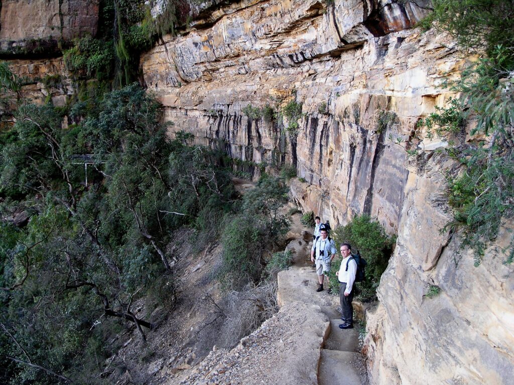 Guests walking a cliff face trail, Blue Mountains